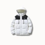 Doudoune de ski femme blanche avec capuche, design moderne avec empiècements noirs, offrant une protection contre le froid.